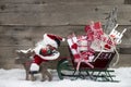 Christmas card decoration: elks pulling santa sleigh of presents