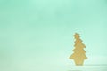 Christmas card with decorative wooden Christmas tree on blue background. New Year holiday concept in minimal style. Copy space Royalty Free Stock Photo