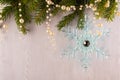 Christmas card of fir branches and snowflakes on a blue gray background