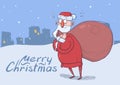 Christmas card of funny confused Santa Claus with big bag of gifts on evening snowy city background. Santa looks Royalty Free Stock Photo