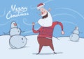 Christmas card of funny smiling Santa Claus in deer sweater dancing next to snowmen in frosty windy weather. Horizontal