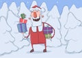 Christmas card of funny smiling Santa Claus with presents. Santa carries gifts in colorful boxes through snowy fir Royalty Free Stock Photo