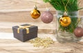 Christmas card, gift box and fir branches with Christmas balls and snowflake on wooden background. Royalty Free Stock Photo