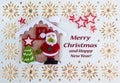 Christmas Card with Greetings Text, Decoration made of Santa Claus with Tree and Stars in Little Haus Royalty Free Stock Photo