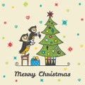 Christmas card with hand drawn owl parent and child decorating a Christmas tree.