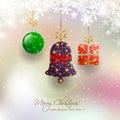 Christmas card with hanging bauble,gift box,bell on magical snowfall background