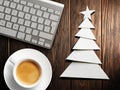 Christmas card. Keyboard, cup of coffee and Christmas tree made of paper Royalty Free Stock Photo