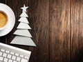 Christmas card. Keyboard, cup of coffee and Christmas tree made of paper Royalty Free Stock Photo