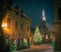 Christmas tree and Church, snowy night, Petit-Champlain, Old Quebec City, Canada Royalty Free Stock Photo