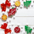 Christmas card: multi-colored Christmas toys and ginger cookies in the form of green Christmas trees lie on a colorful background Royalty Free Stock Photo