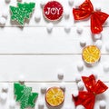 Christmas card: multi-colored Christmas toys and ginger cookies in the form of green Christmas trees lie on a colorful background Royalty Free Stock Photo