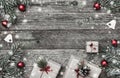 Christmas card, on old wooden background. Gifts, red balls and handmade toys. Space for text. Top view Royalty Free Stock Photo