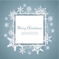 Christmas card with paper snow flake. Falling snowflakes on a dark blue winter background.