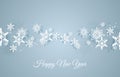 Christmas card with paper snow flake. Falling snowflakes on a dark blue winter background.