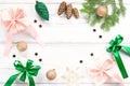 Christmas card with pink and emerald green elements, golden ornaments, confetti and wrapped gifts. Christmas flat lay Royalty Free Stock Photo