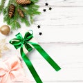 Christmas card with pink and emerald green elements, golden ornaments, confetti and wrapped gifts. Christmas flat lay Royalty Free Stock Photo