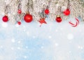 Christmas card. Red Xmas decorations and green winter frozen fir with snow Royalty Free Stock Photo