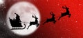 Christmas card with santa claus, reindeer, sleigh, gift and christmas tree on the background of the big moon in the night Royalty Free Stock Photo