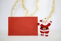 Christmas card and Santa clause doll Royalty Free Stock Photo