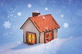 Christmas card, a small model of a wooden house with a cozy light in the windows on a winter snowy evening Royalty Free Stock Photo