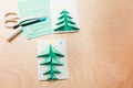 Christmas card, a stack of colored paper of different sizes, scissors and glue Royalty Free Stock Photo