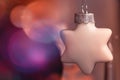 Christmas card with star ornament and purple christmas ball bokeh background Royalty Free Stock Photo