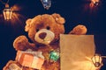 Gtreeting card with Teddy bear gifts and fairy lights garland Royalty Free Stock Photo