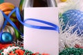 Christmas card with wine bottle pearls and empty paper note Royalty Free Stock Photo