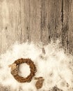 Christmas card with wreath and little hare from birch bark on a wooden background. Royalty Free Stock Photo