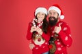 Christmas Carol. Father and daughter with candy canes christmas decorations. Family holiday. Santa claus family look