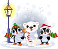 Christmas carolers. Polar bear and two penguins Royalty Free Stock Photo