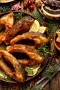 Christmas carp, Fried carp fish slices on a ceramic plate, close up, top view. Traditional christmas eve dish.