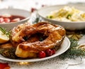 Christmas carp, Fried carp fish slices on a ceramic plate on the holiday table