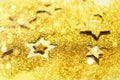 Christmas celebration. Abstract background for new year party. Patter of gold stars with lights, bokeh. Golden glitter stars on Royalty Free Stock Photo