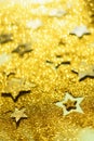 Christmas celebration. Abstract background for new year party. Patter of gold stars with lights, bokeh. Golden glitter stars on Royalty Free Stock Photo