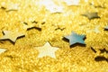 Christmas celebration. Abstract background for new year party. Patter of gold stars with lights, bokeh. Golden glitter stars on Royalty Free Stock Photo