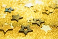 Christmas celebration. Abstract background for new year party. Patter of gold stars with lights, bokeh. Golden glitter stars on Royalty Free Stock Photo