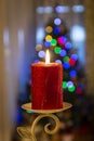 Christmas celebration with candle and tree ornaments