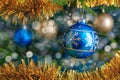 Christmas-tree decoration bauble on decorated Christmas tree bac Royalty Free Stock Photo