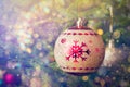 Christmas-tree decoration bauble on decorated Christmas tree bac Royalty Free Stock Photo