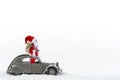 Christmas Celebration, Santa Claus Standing In A French 2cv Vintage Car With Gift Sack, Isolated On White Background