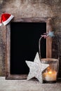 Christmas chalkboard with decoration. Santa hat, stars, Wooden