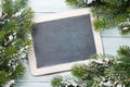 Christmas chalkboard and fir tree with snow