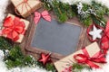 Christmas chalkboard, gift boxes, decor and fir