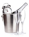 Christmas champagne with alarm clock in bucket and empty glasses Royalty Free Stock Photo