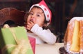 Christmas child finger licking sugar Royalty Free Stock Photo