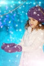 Christmas child girl on winter tree background, snow, snowflakes Royalty Free Stock Photo