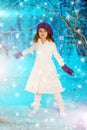 Christmas child girl on winter tree background, snow, snowflakes Royalty Free Stock Photo