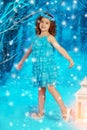 Christmas child girl on winter tree background, snow, snowflakes Royalty Free Stock Photo