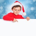 Christmas child kid boy Santa Claus pointing empty banner sign copyspace Royalty Free Stock Photo